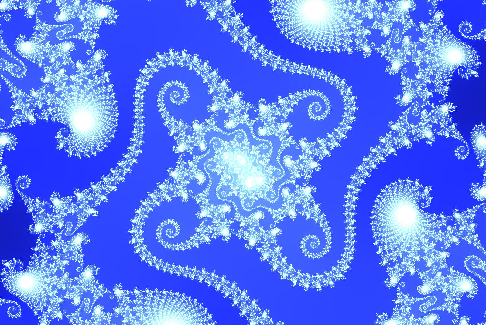 Blue swirls on the Mandelbrot set boundary.